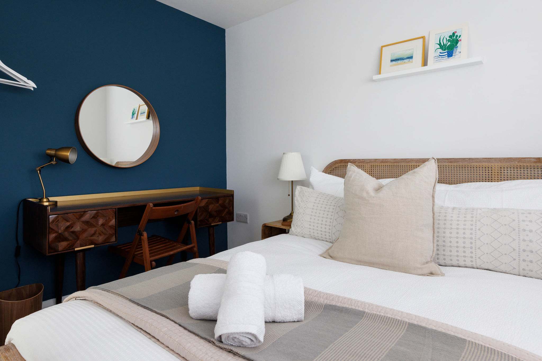 There is a multi functional desk that can be used as a vanity unit or a work desk.