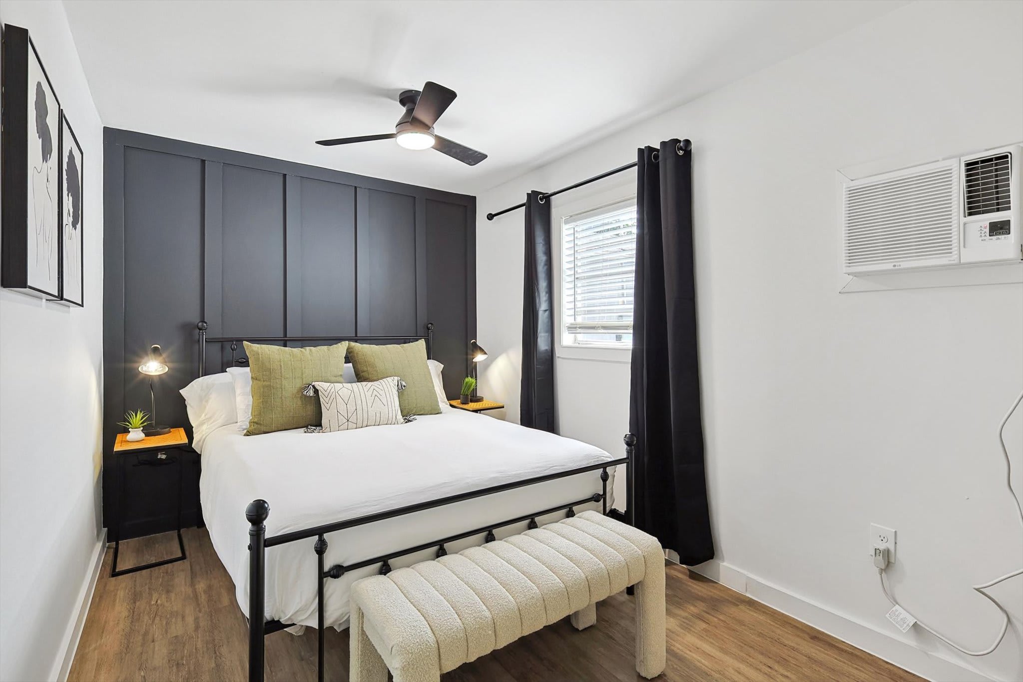 Relax in this beautifully designed room featuring a plush queen-size bed, modern decor, and soft lighting