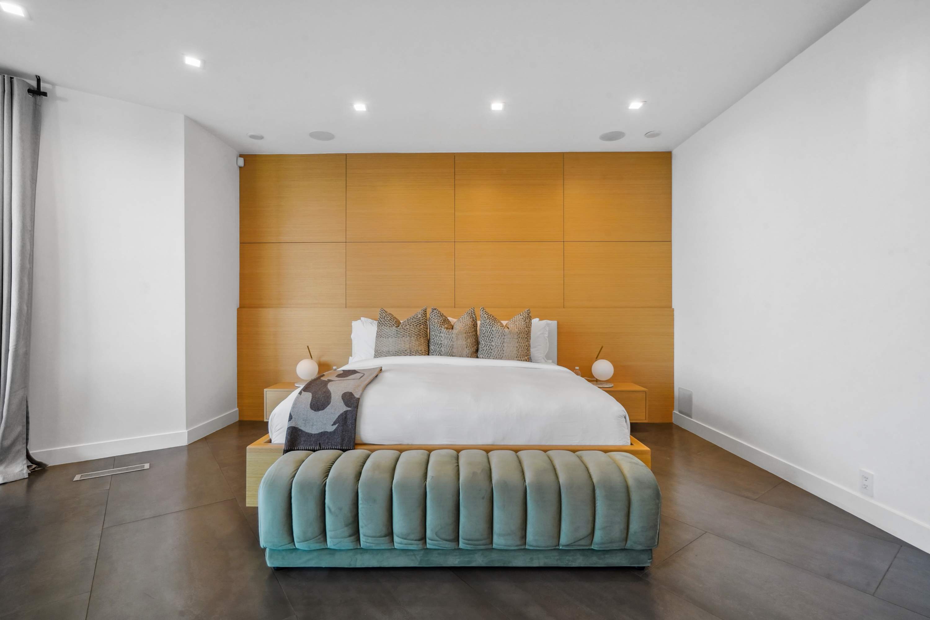 Bedrooms with plush beds, custom cabinetry, and unique lighting accents.