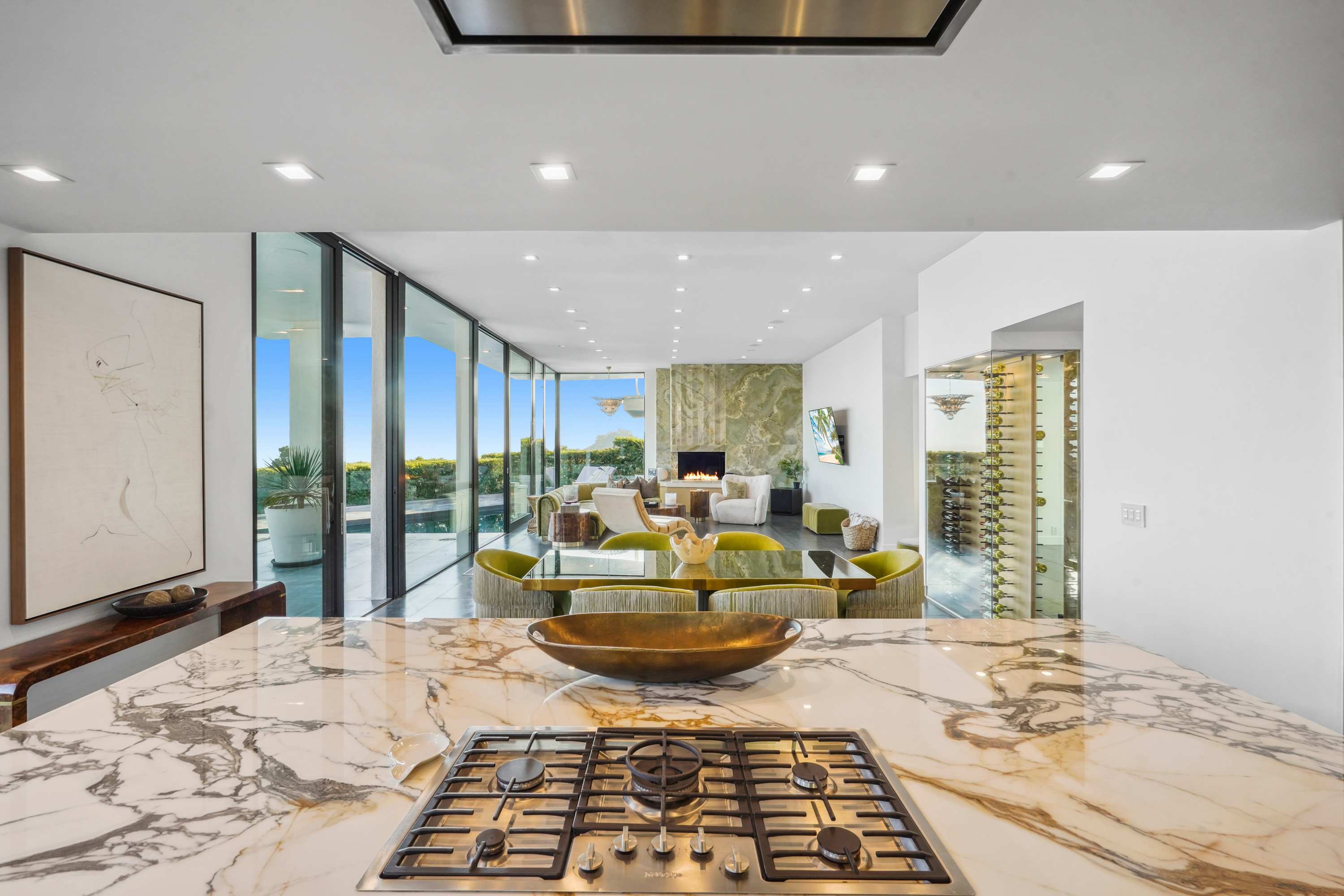 Gourmet stove set into a sleek marble island, perfectly positioned for entertaining with panoramic views.