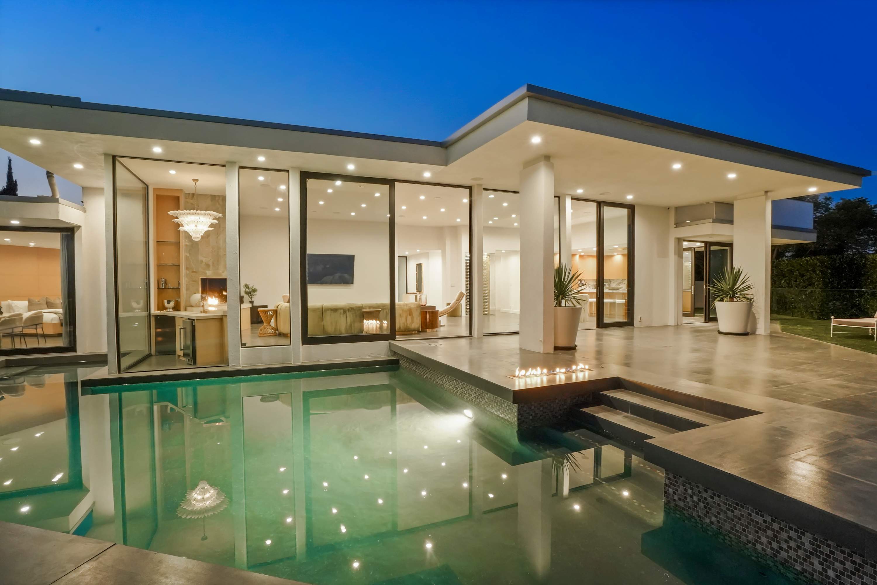 Seamless indoor-outdoor access between the living area and pool.