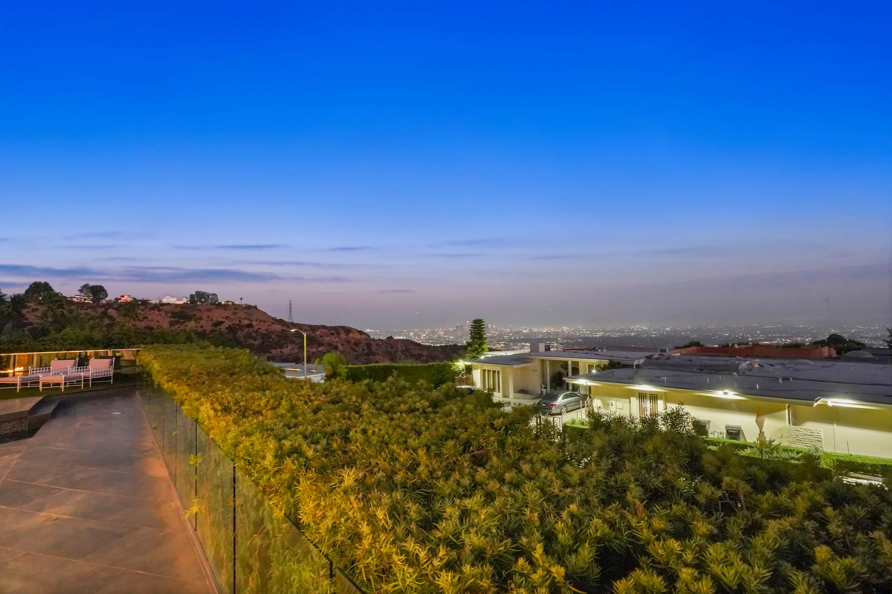 Lush greenery surrounds the home, providing both beauty and privacy.