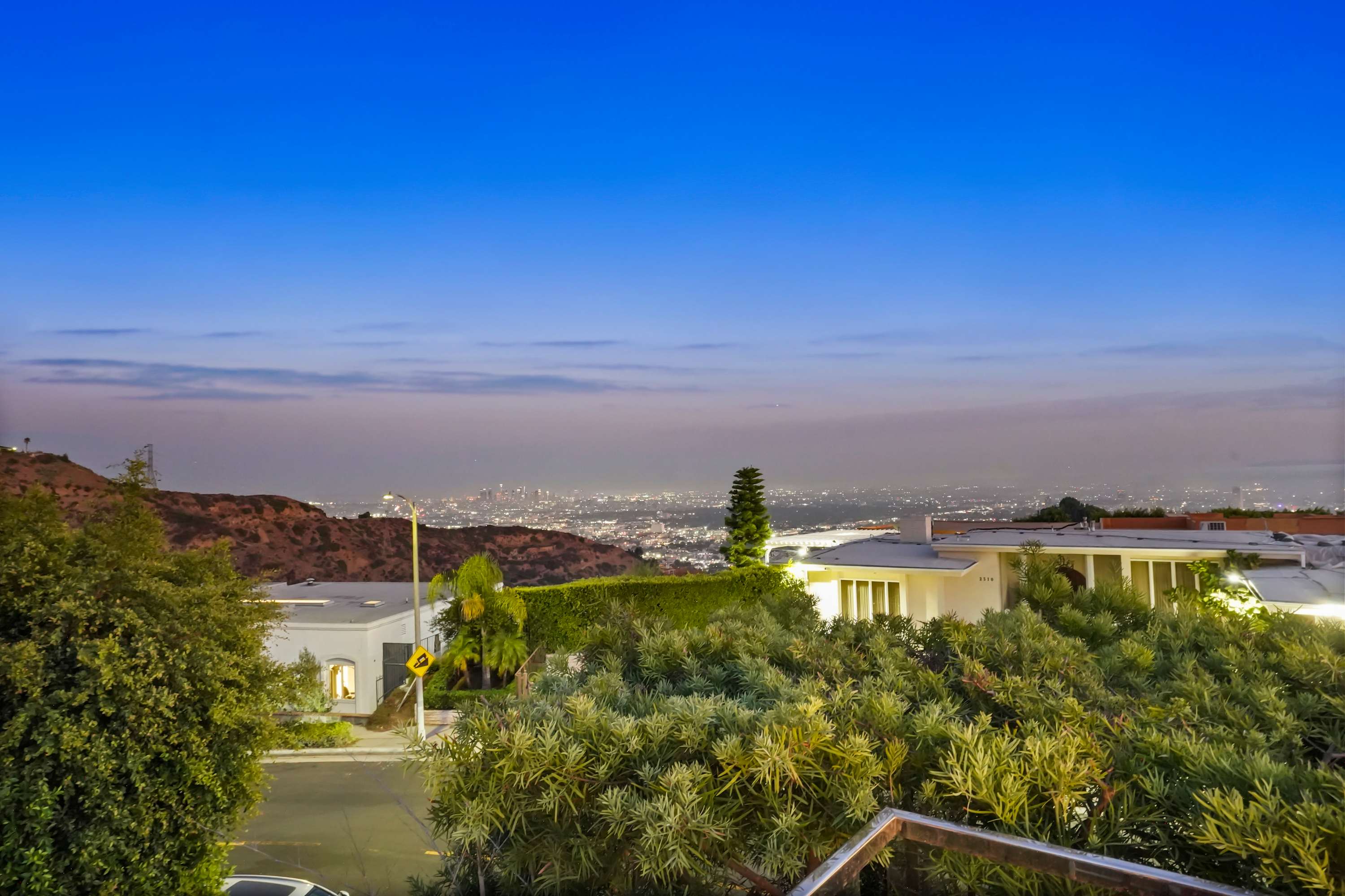 Expansive city skyline views stretch across the horizon.