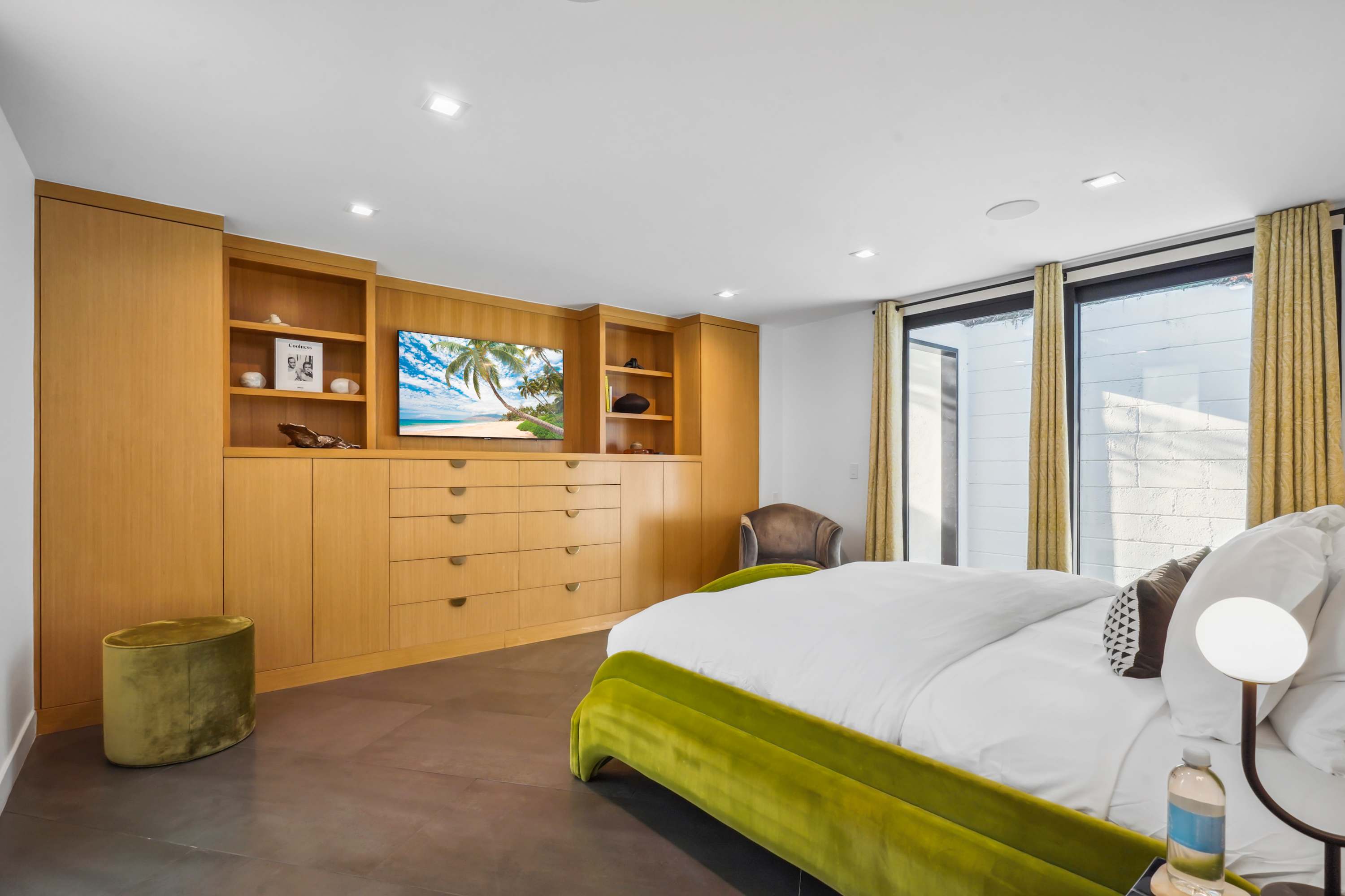 Smart TVs and custom cabinetry in every bedroom for convenience and style.