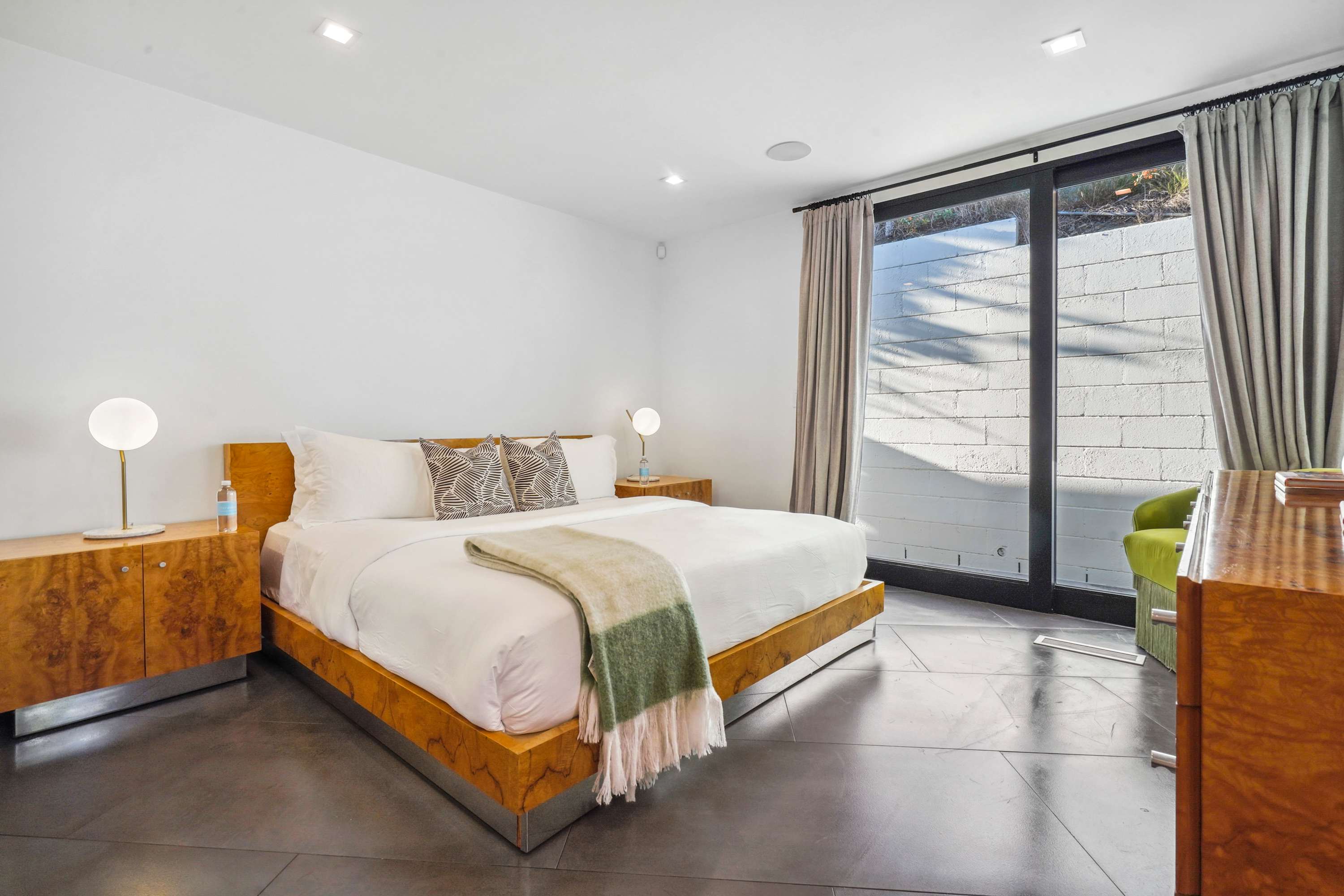The bedrooms feature plush beds with premium linens and blackout shades for ultimate comfort.