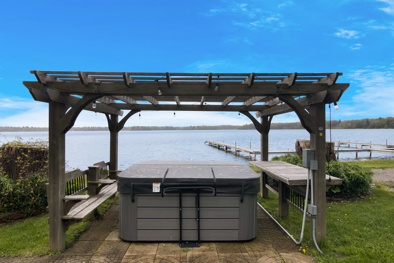 Lakefront Cottage with Hot Tub & Fire Pit — Fife Lake, MI — vacation rental