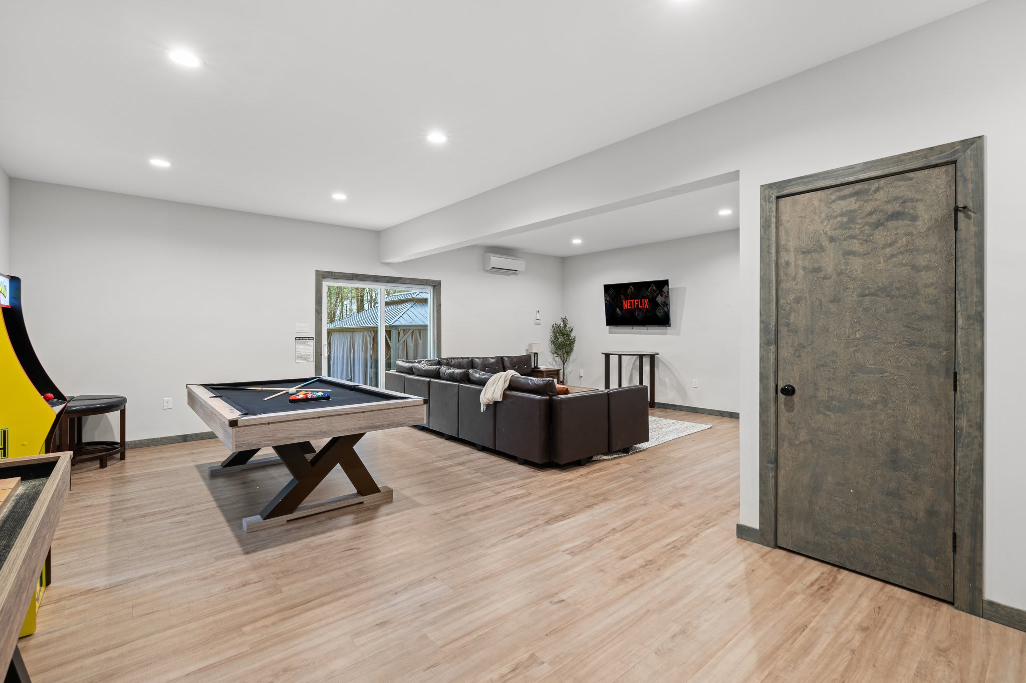 From pool table to arcade classics, this room brings the entertainment. There's plenty of space to play and hang out.