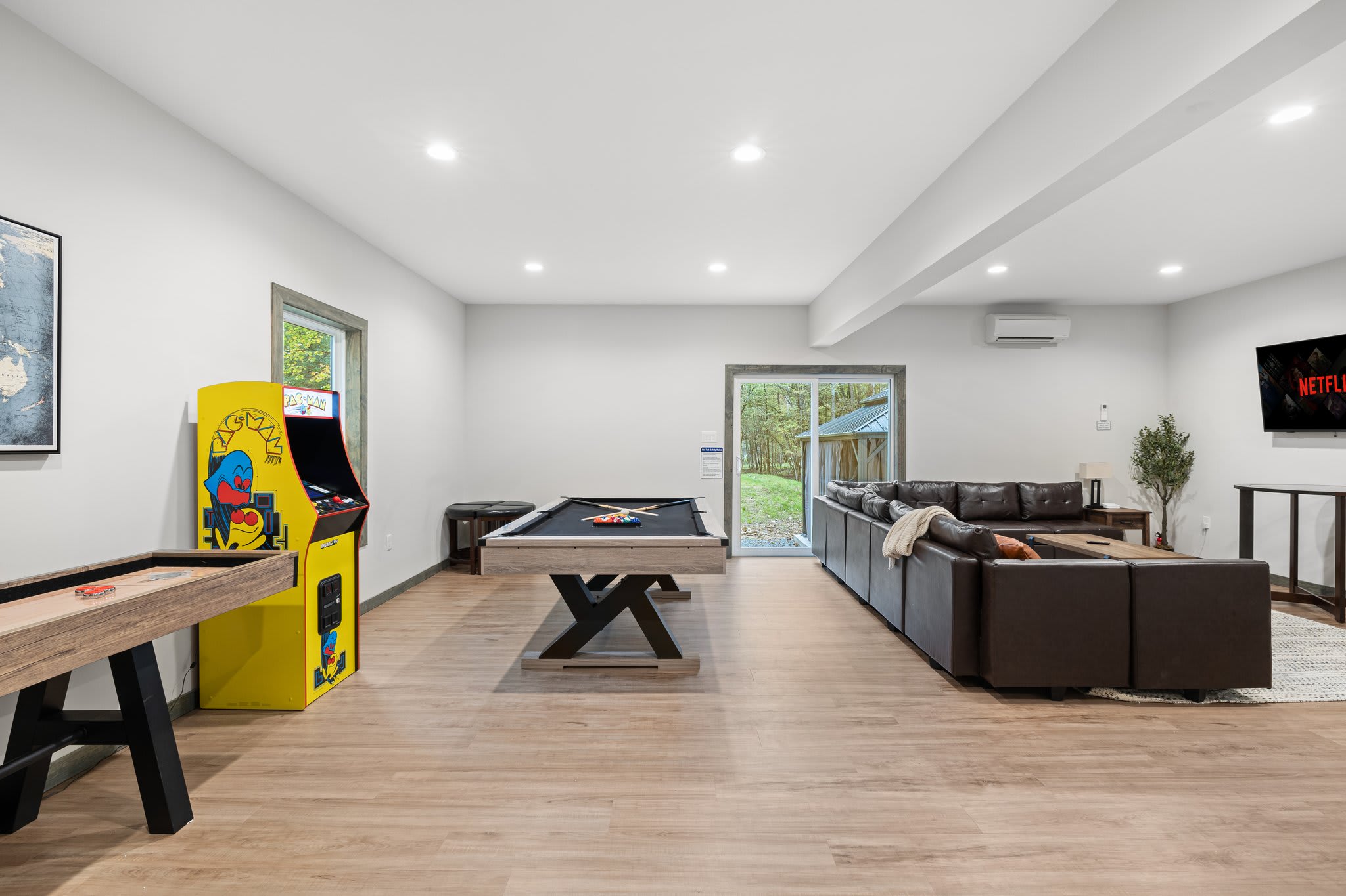 Lounge and Arcade Setup
A great mix of comfort and fun with seating, retro arcade games, and a pool table all in one place.
