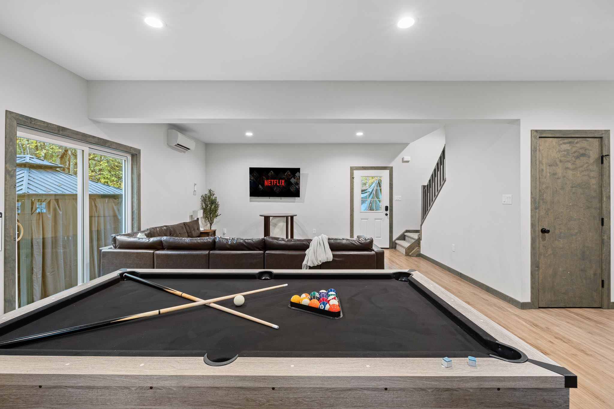 Pool Table Centered View
A great shot of the game table with cues ready. This space is built for friendly competition and laid-back fun.