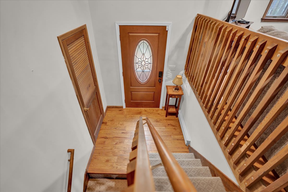 Rustic Stairway Charm – A beautiful wooden staircase leading to the heart of the home, adding warmth and character to the space.