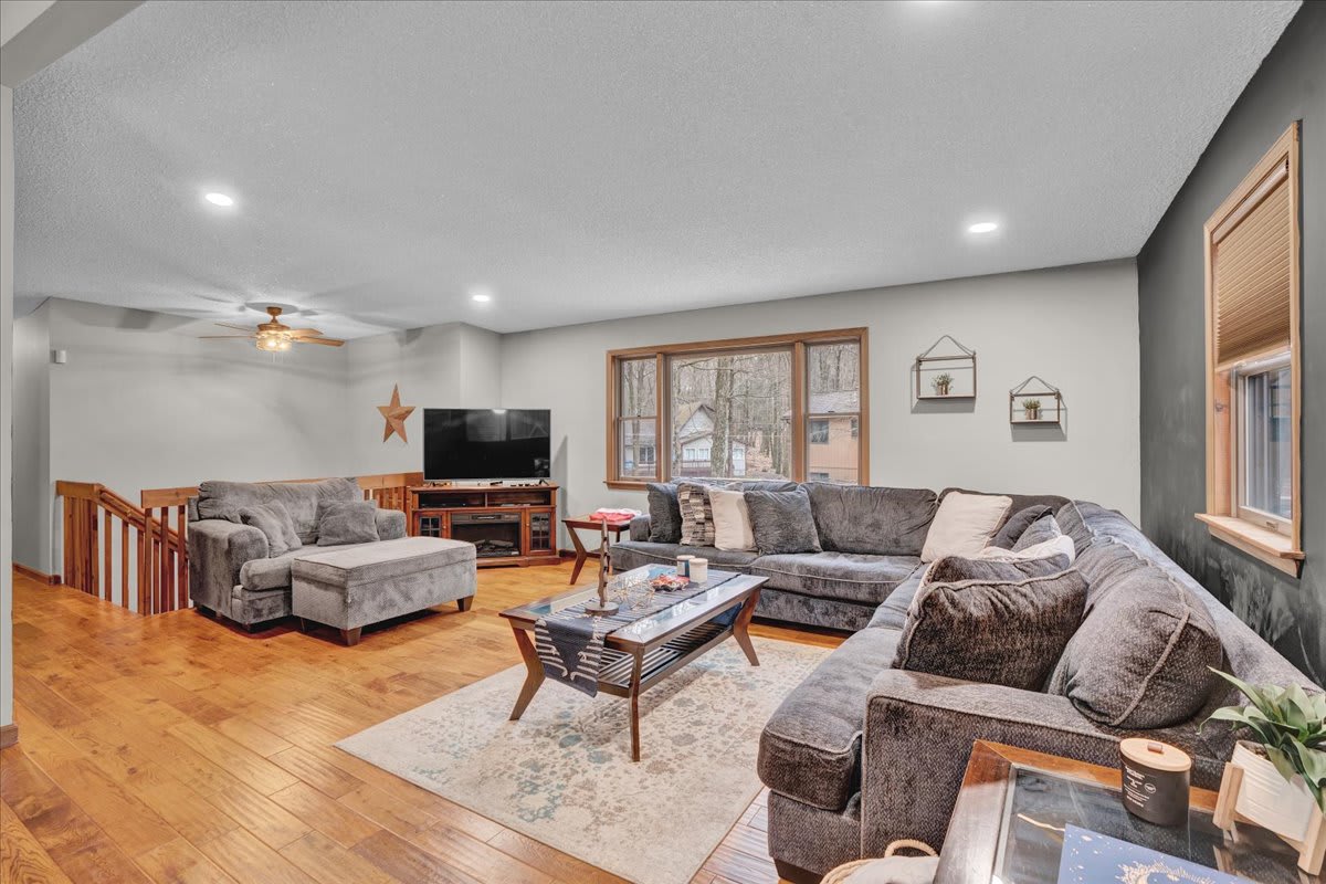 Spacious & Inviting Living Room – A beautifully designed gathering space featuring plush seating, a large TV, and an open layout for ultimate comfort.