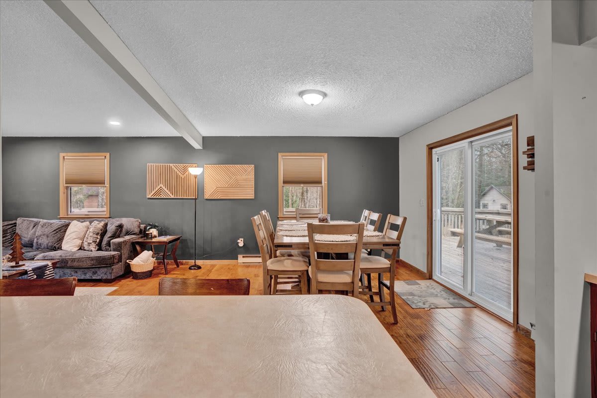 Open-Concept Dining & Living Area – A beautifully designed space that seamlessly connects the dining and living areas, creating a cozy and functional gathering spot.c