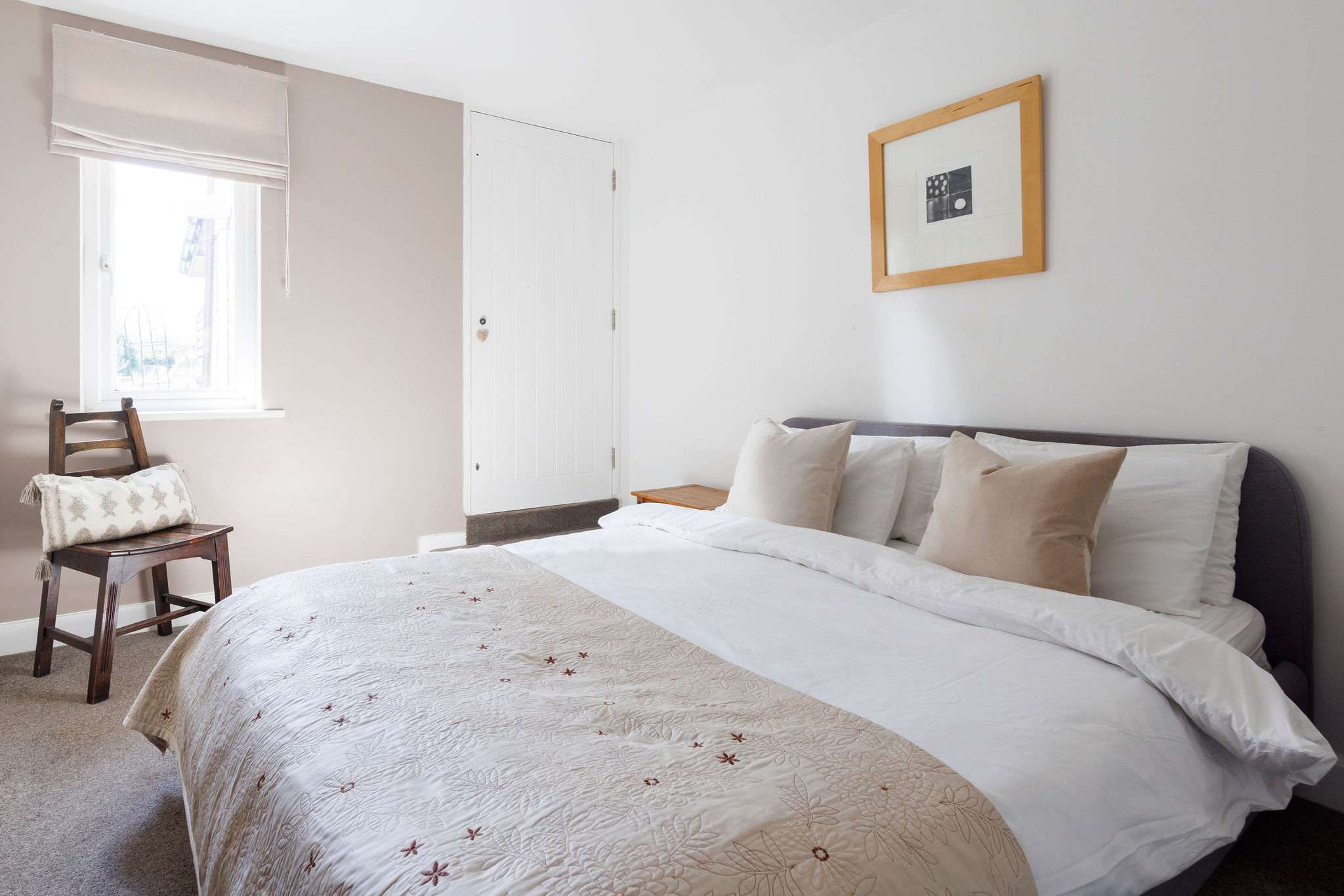 The downstairs double has quality bedding and linen, and is decorated in soft, neutral tones.