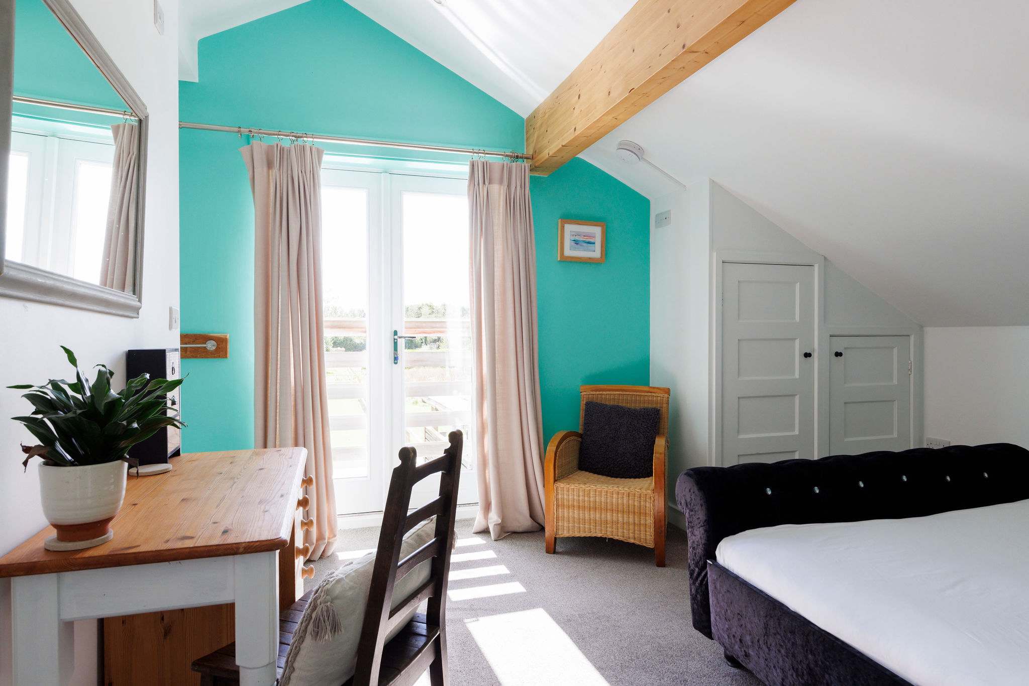 The master room is spacious and lets plenty of natural light in.