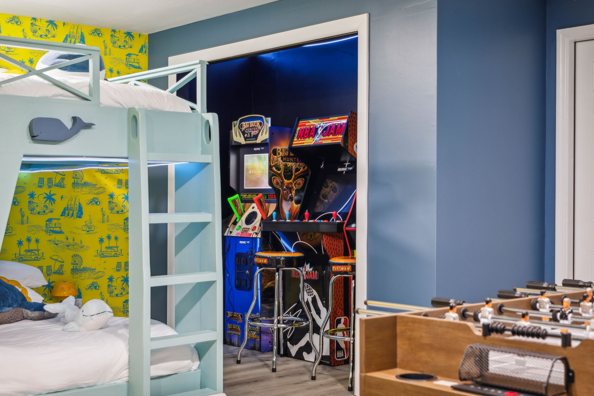 Kids' bedroom with arcade game amenity