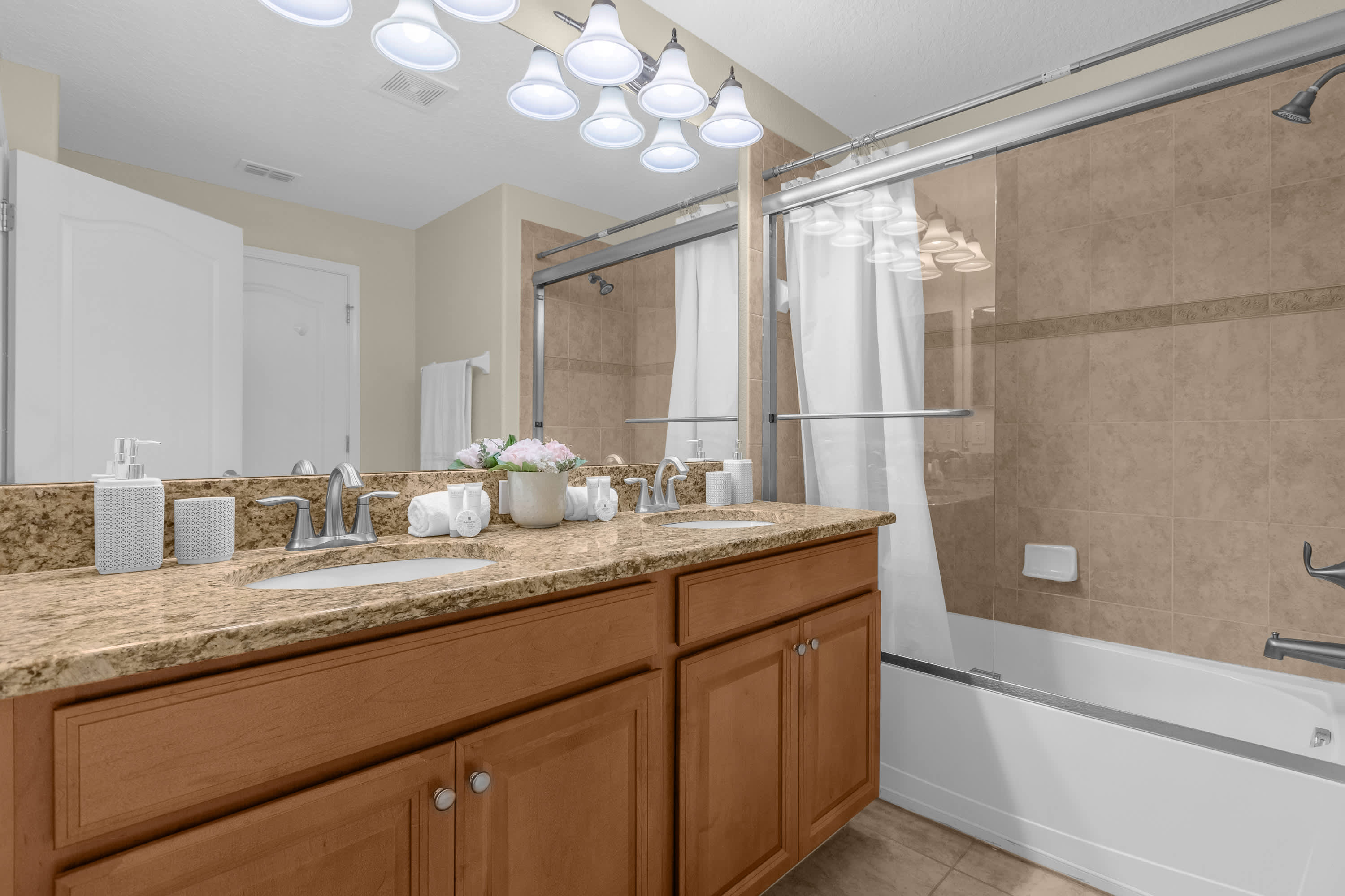 Spacious Bathroom with Double Vanity and Combined Bathtub and Shower
