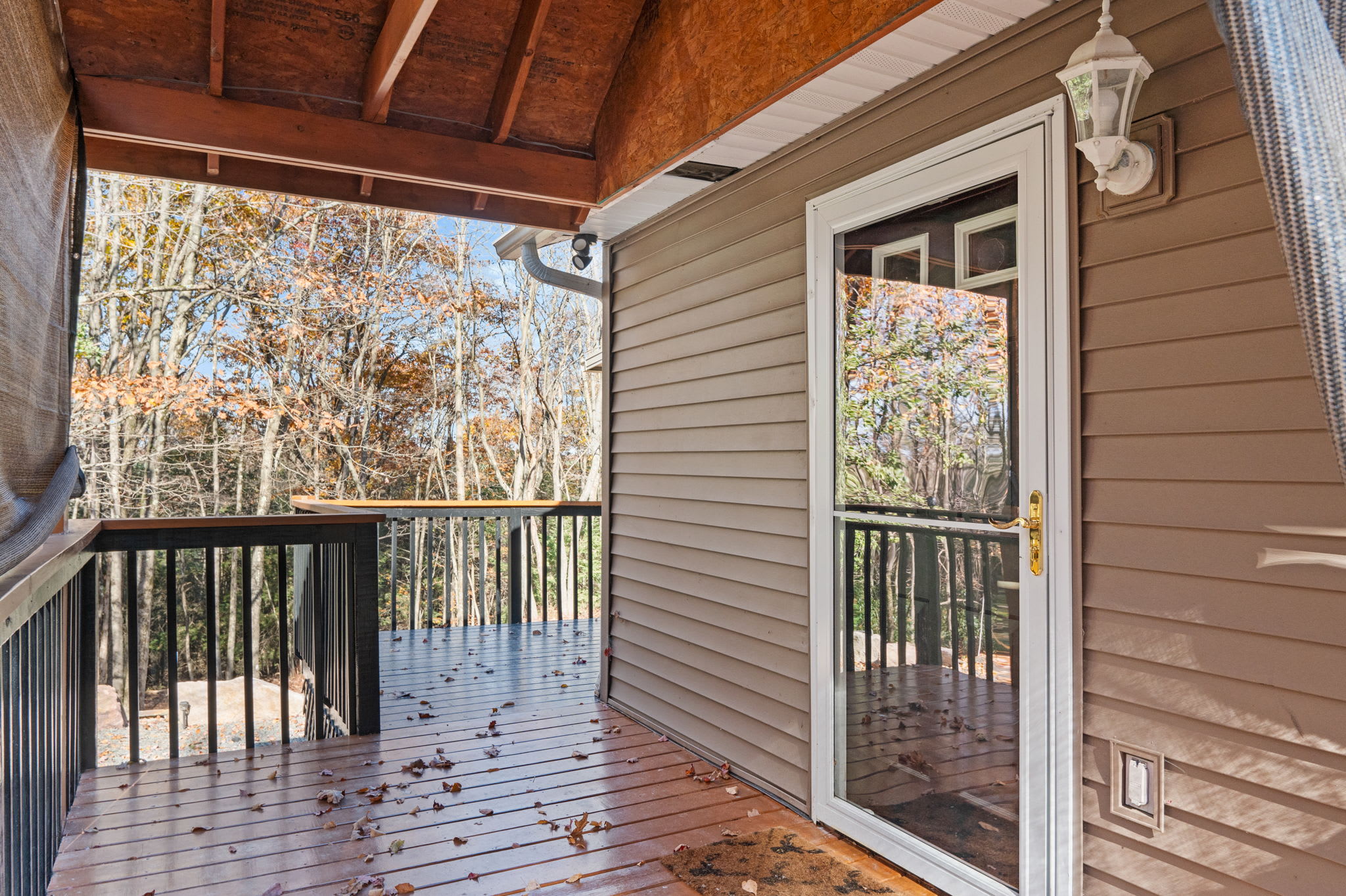 A sheltered deck invites you to linger outdoors, where forest views and fresh air become part of your stay.