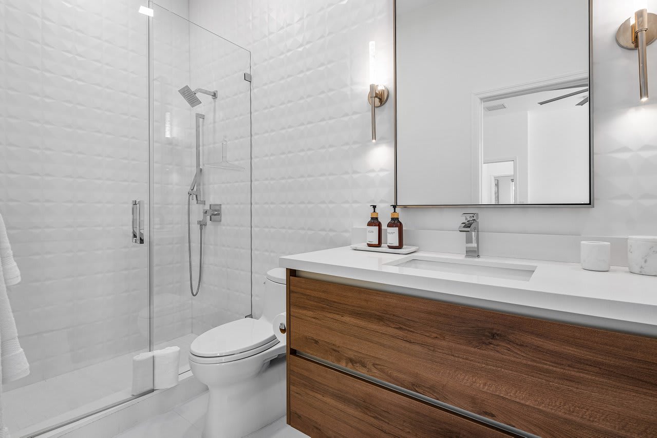 Step into a modern sanctuary, where sleek finishes and thoughtful details make every refresh feel indulgent.