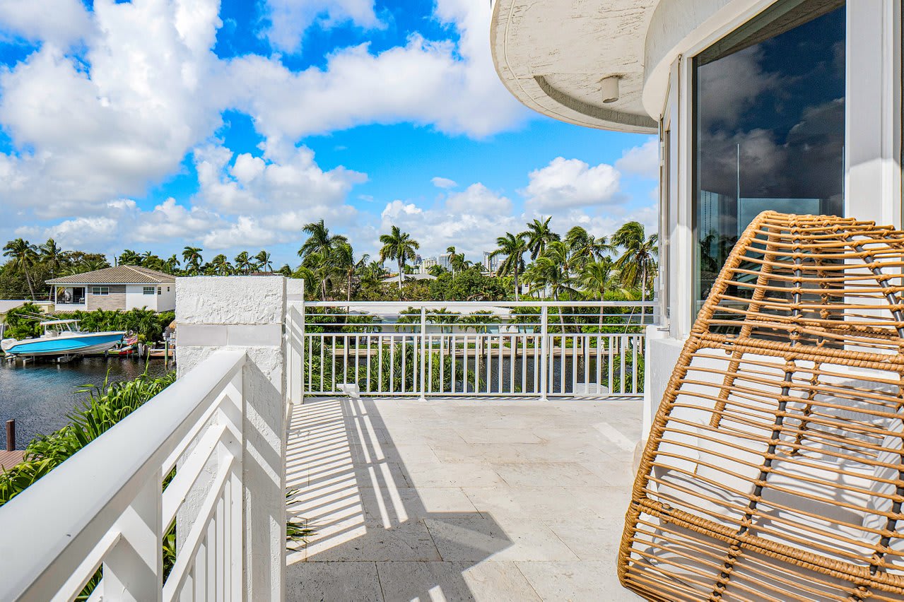 Bask in the Florida sunshine on the private balcony, offering a serene spot for relaxation and scenic views.