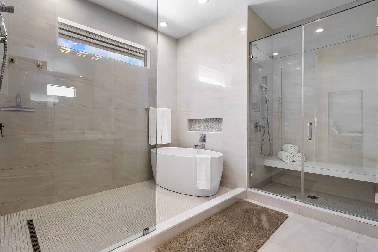 Step into pure bliss—this master bath is a sanctuary of luxury with exquisite stone details that make every moment feel like an escape.