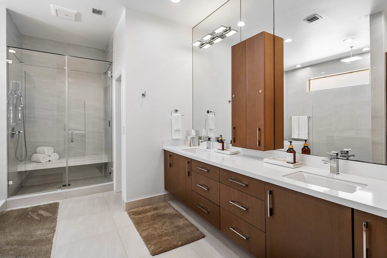 Sleek cabinetry, and ample lighting for a refreshing start to your day.