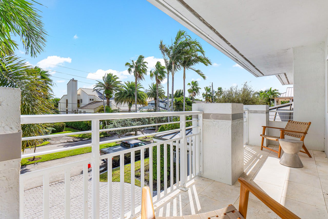 Private balcony with comfortable seating, perfect for enjoying morning coffee and scenic views.