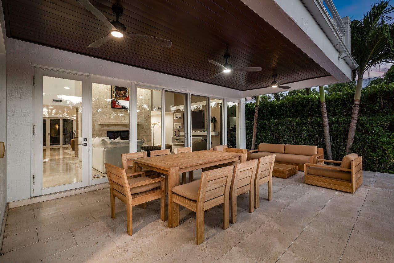 Enjoy alfresco dining surrounded by lush landscaping for a relaxed outdoor experience.