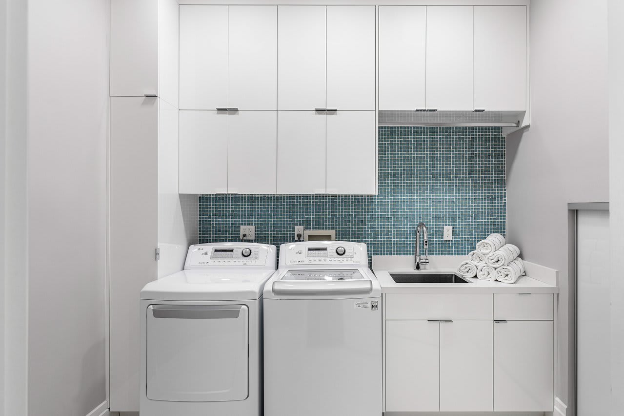 Equipped with high-efficiency washer and dryer, ample storage.