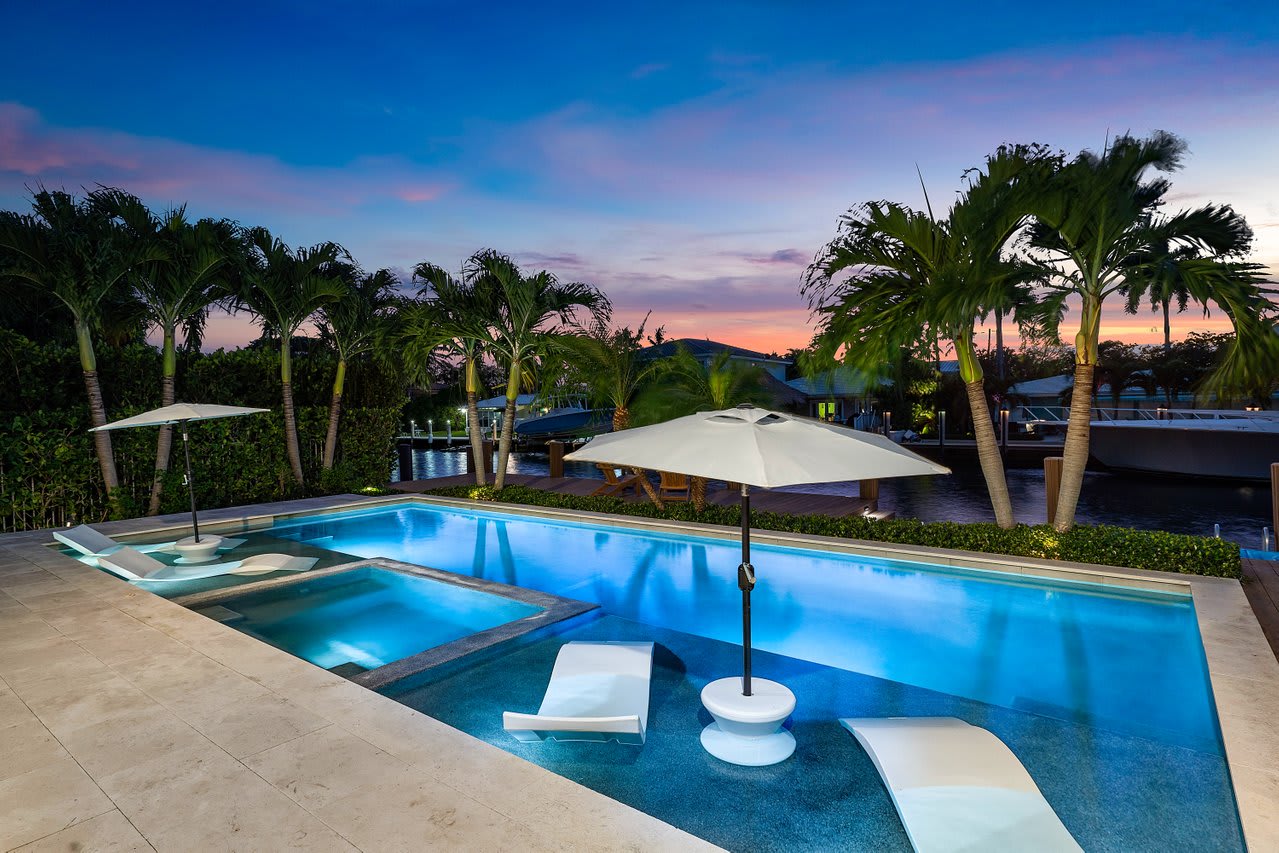 Your private oasis, complete with a sparkling pool and lush landscaping,