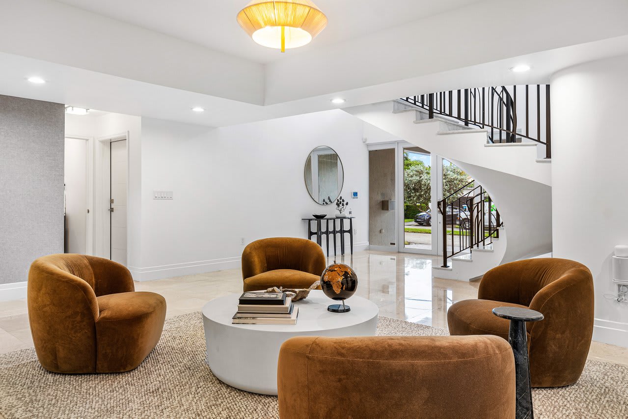 Intimate nook with soft upholstery and natural stone flooring, perfect for quiet moments.
