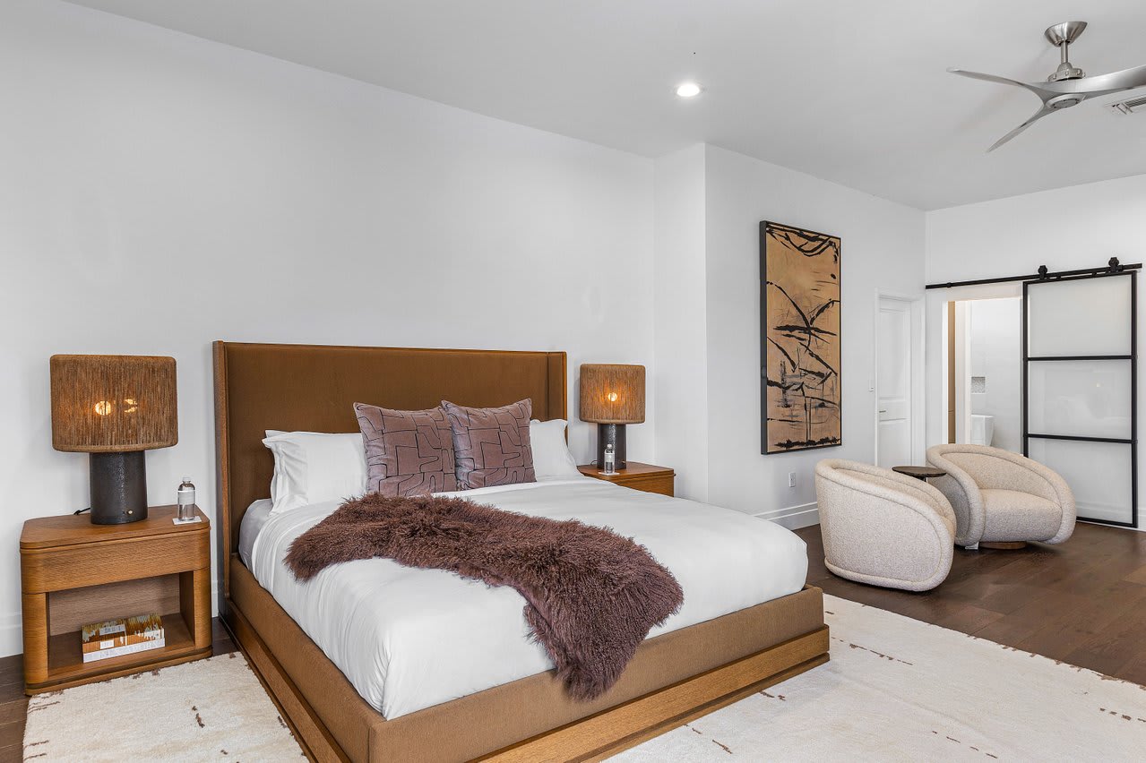Luxurious bedroom suite with plush bedding and elegant furnishings.