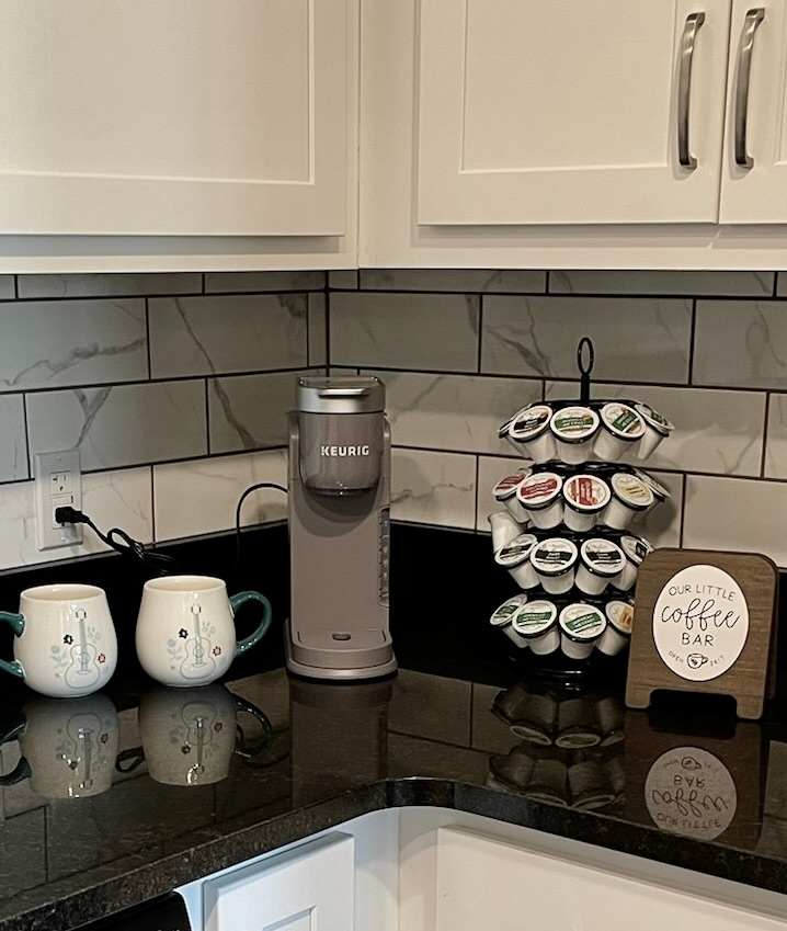 Coffee bar with a Keurig coffee maker and plenty of K-pods to get your started on your morning coffees!