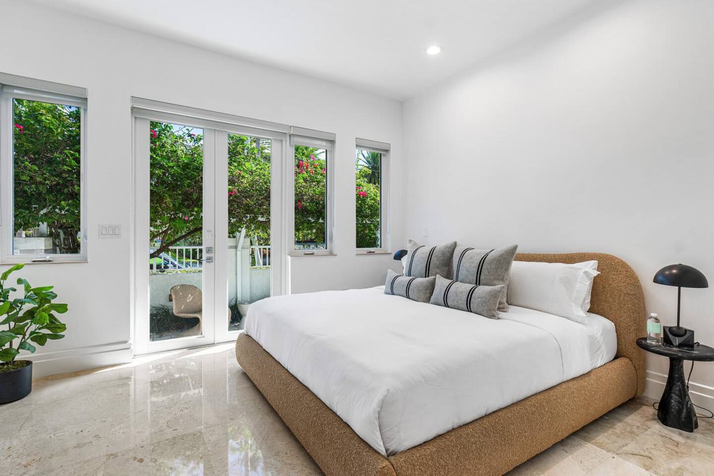 Serene guest bedroom with lush garden views designed for ultimate relaxation
