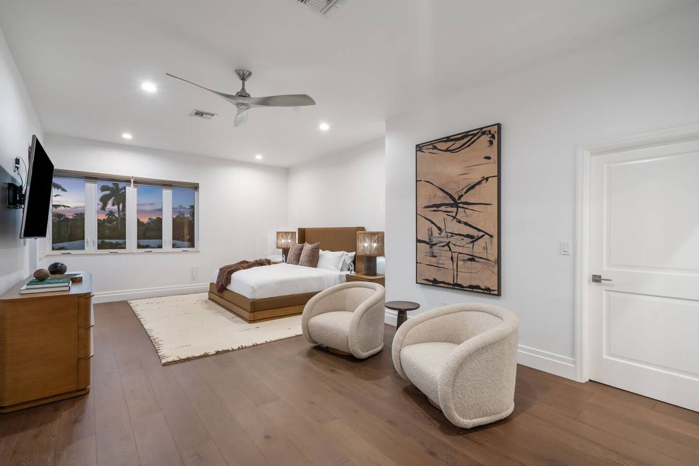 Retreat to the master suite’s cozy nighttime ambiance.