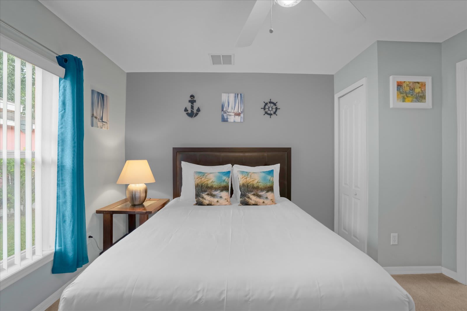 Bedroom With A Queen Bed And Nautical Decor