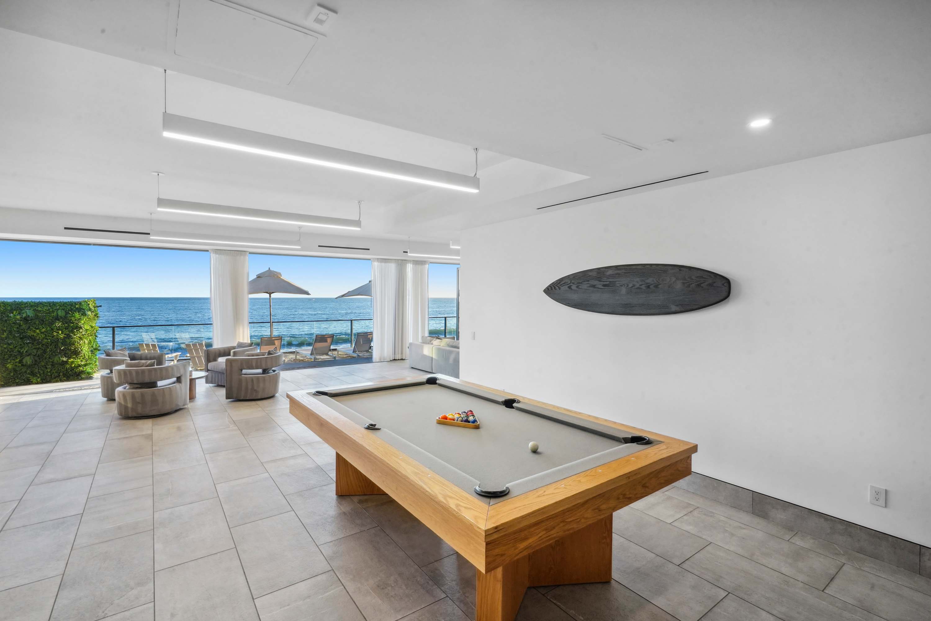 Unwind with a game of pool, where every shot comes with an ocean view.