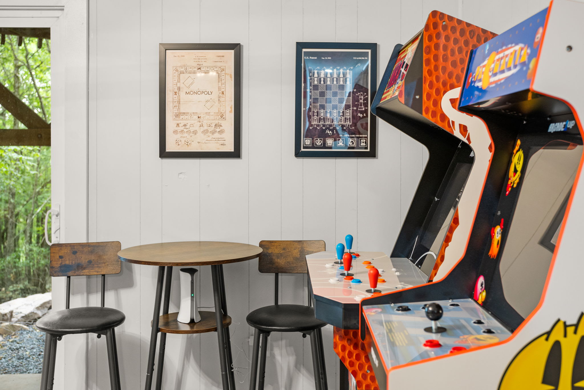  A fully functional Pac-Man arcade machine bringing a fun, old-school gaming vibe to the space.