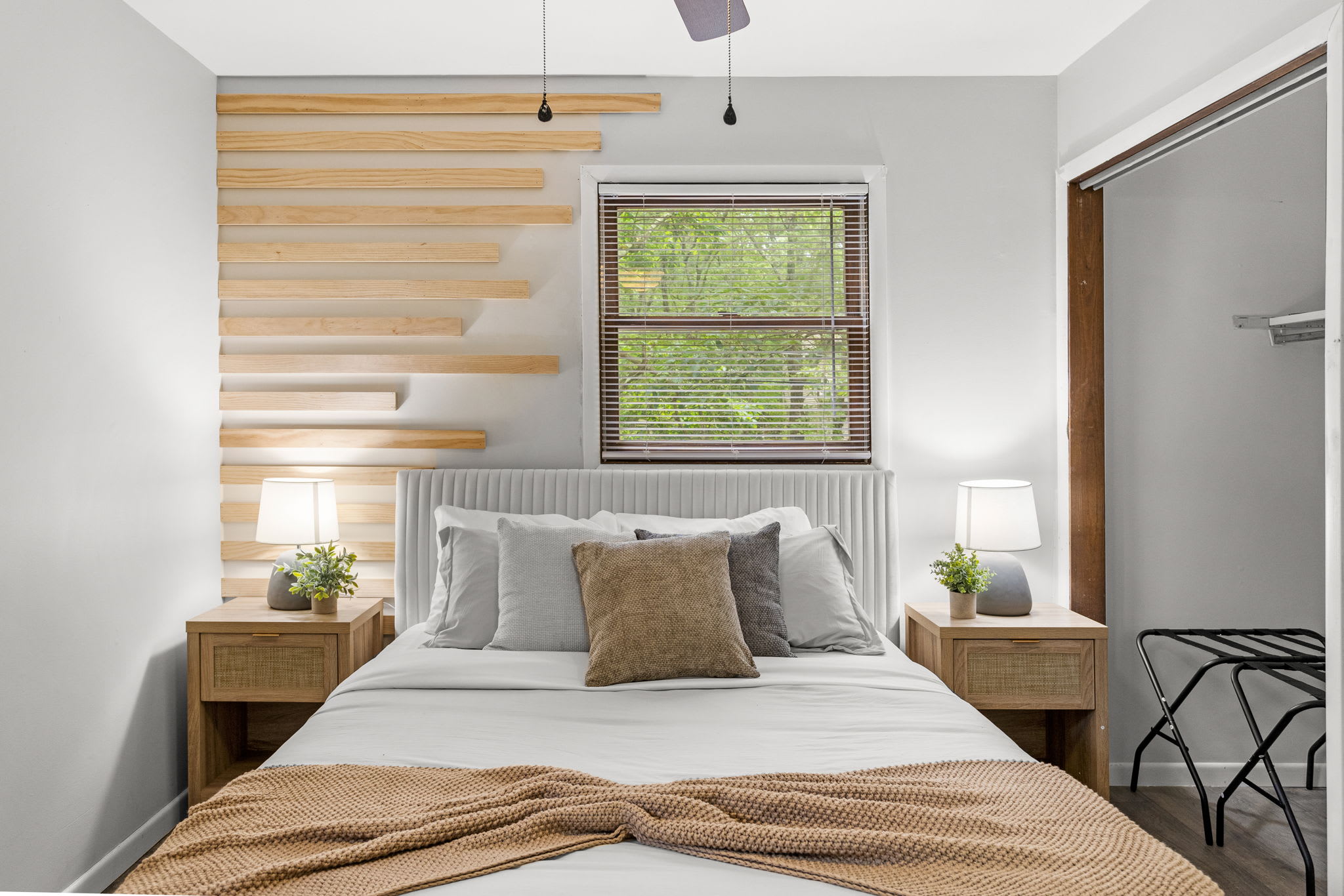 Minimalist & Cozy Master Suite – A beautifully designed bedroom with wood accent walls, soft neutral tones, and modern lighting for ultimate relaxation.