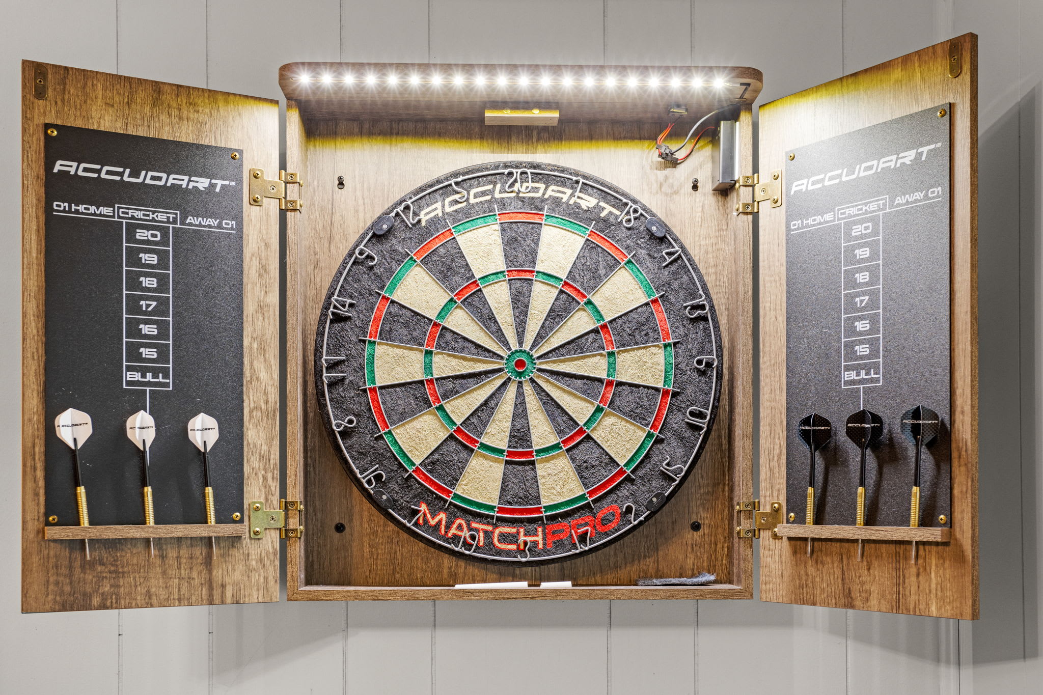 Classic Dartboard for Friendly Competition – A wall-mounted dartboard setup with built-in lighting, adding a fun and interactive element to the space.