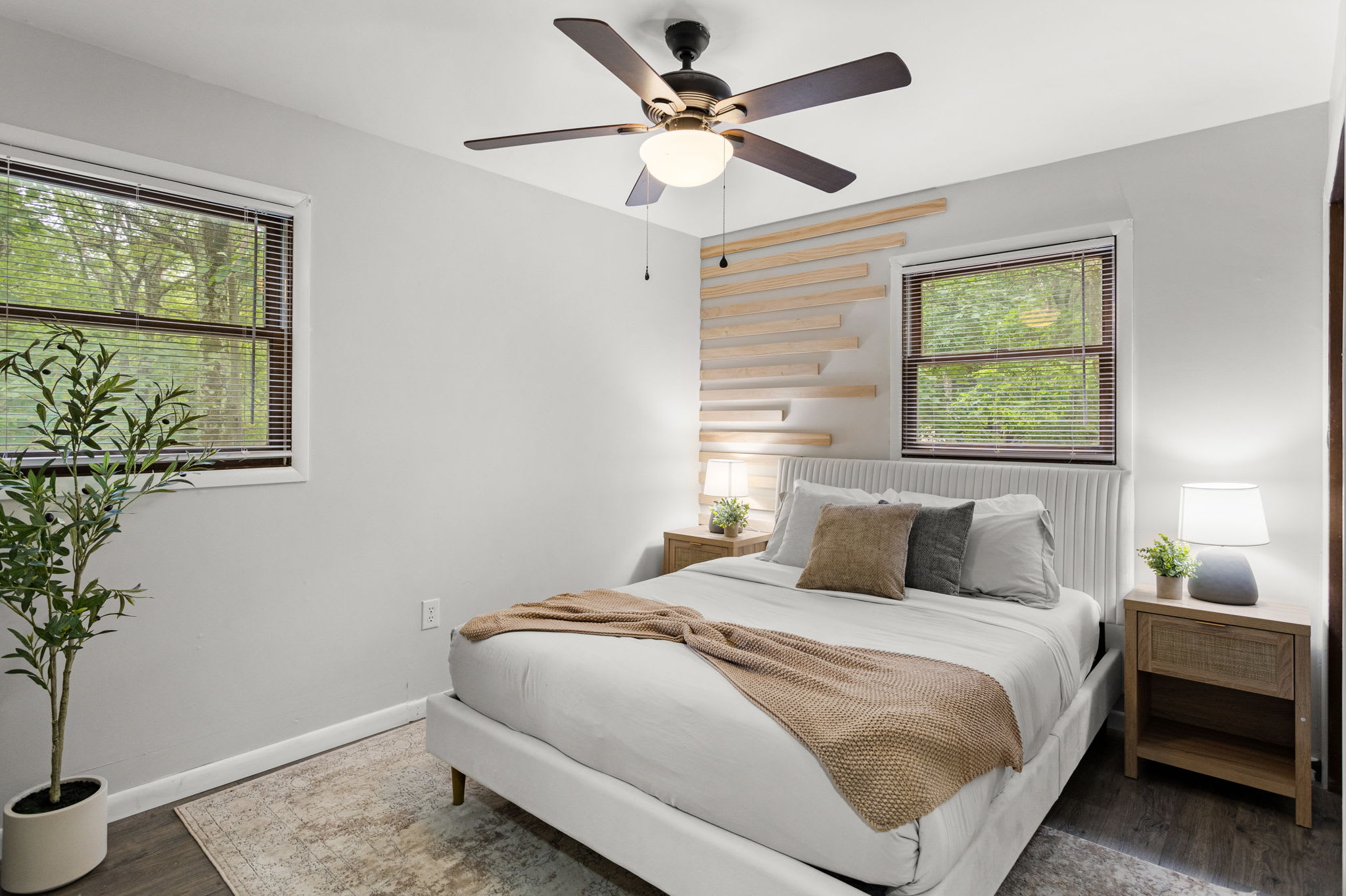 A more expansive view of the room, showing the stylish neutral tones and well-placed furnishings.