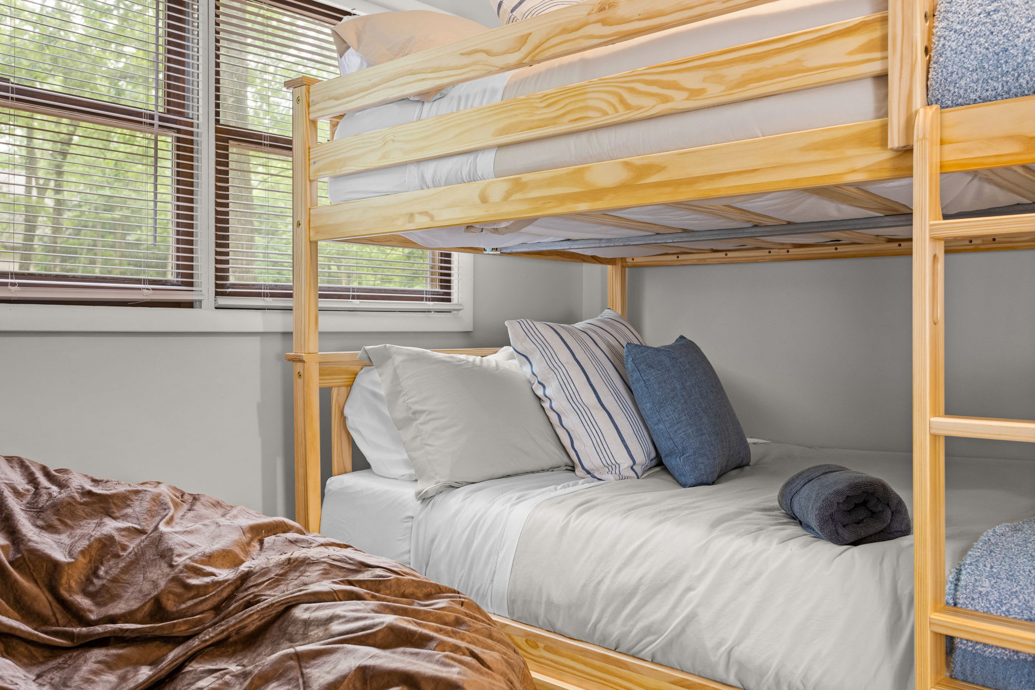 A fun and functional bunk bed setup, perfect for accommodating multiple guests in a cozy shared space.