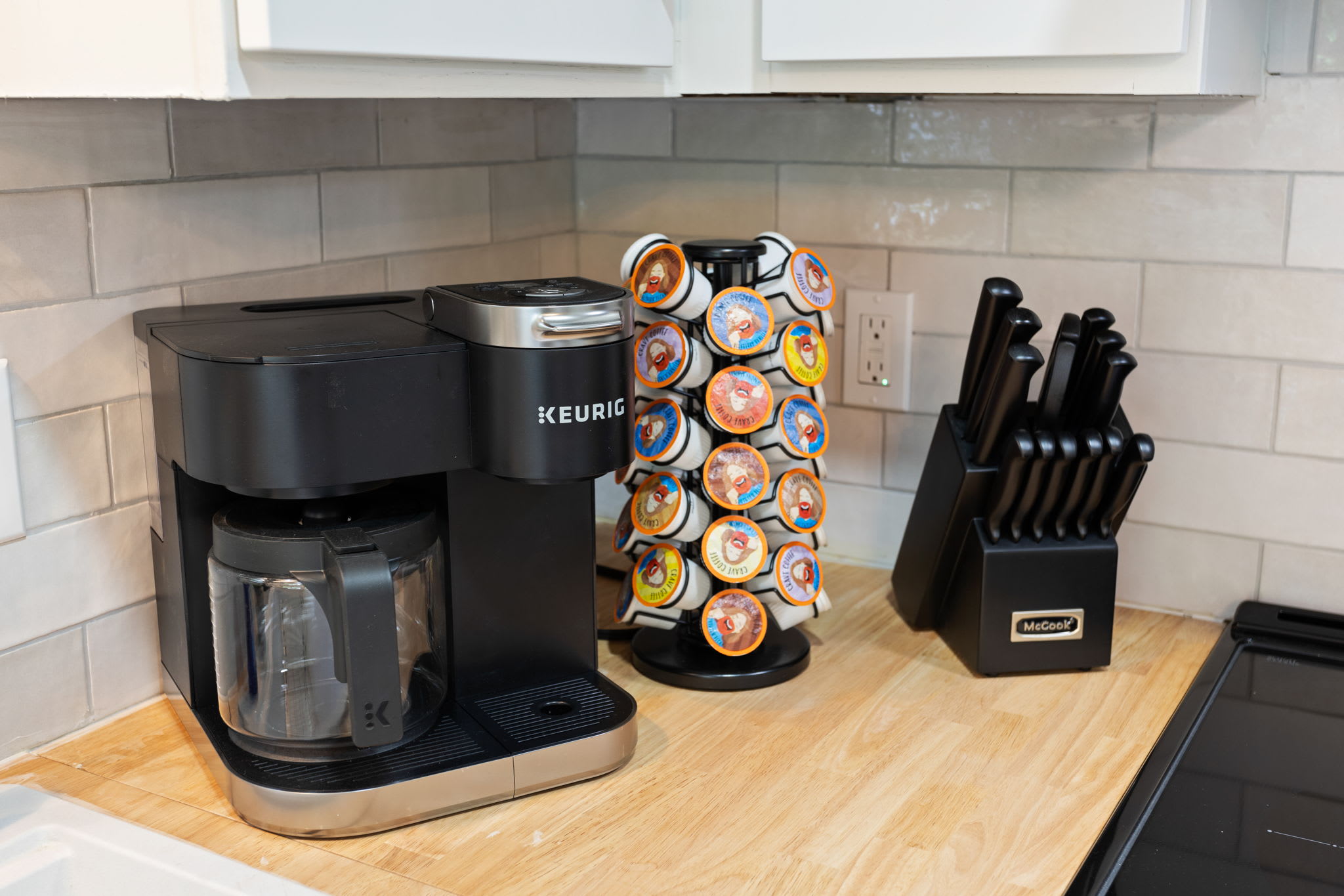 A well-stocked coffee station with a Keurig machine and an assortment of coffee pods, ensuring a great start to the day.