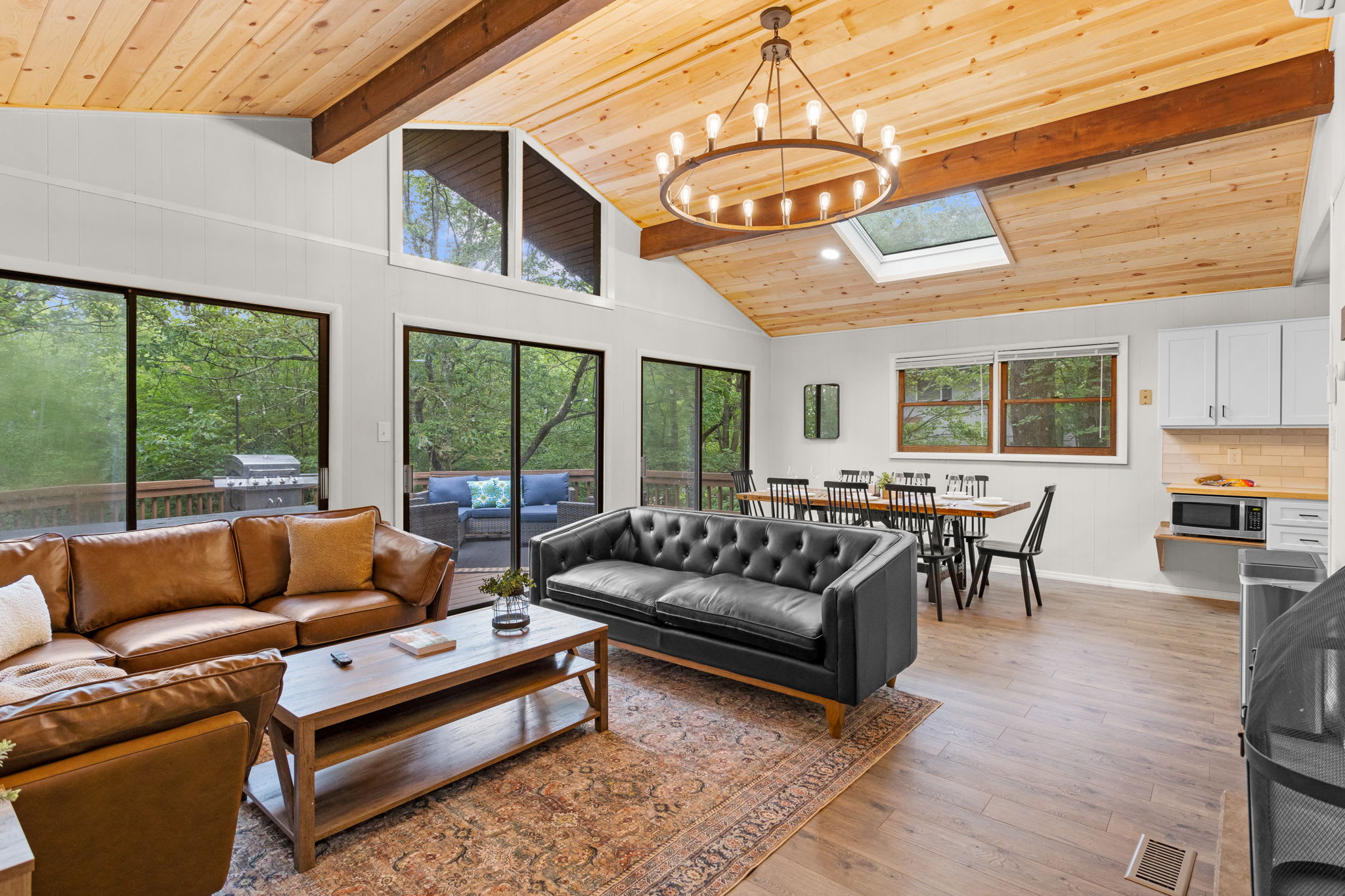The living room, dining area, and kitchen flow seamlessly together, making it an excellent space for entertaining.