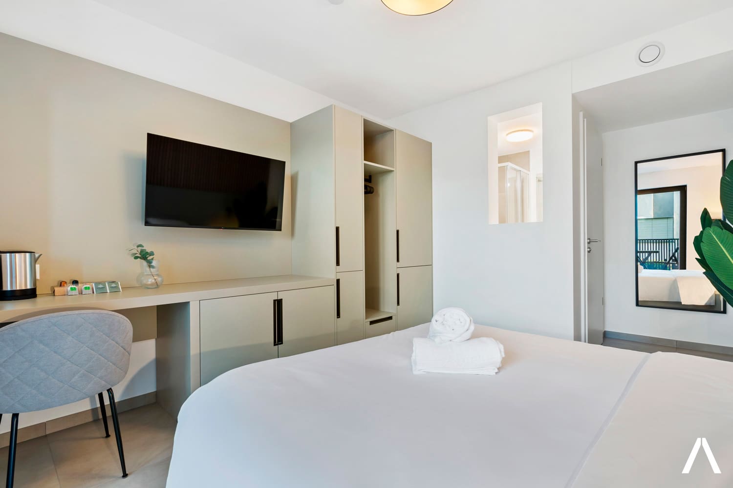 Compact Yet Elegant Interior – Smart layout featuring a comfortable bed, desk, and entertainment area.