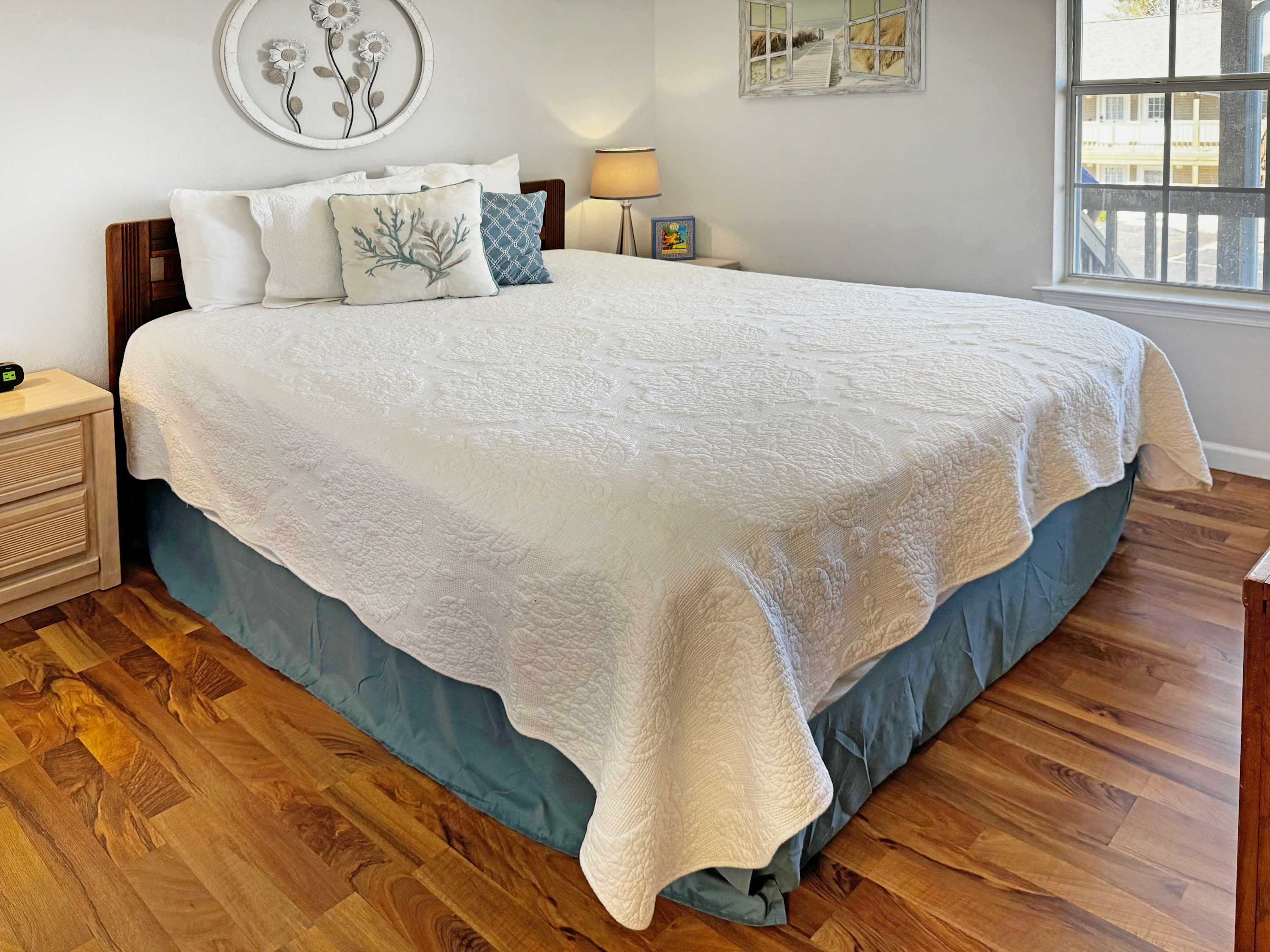 Queen bed in the downstairs bedroom