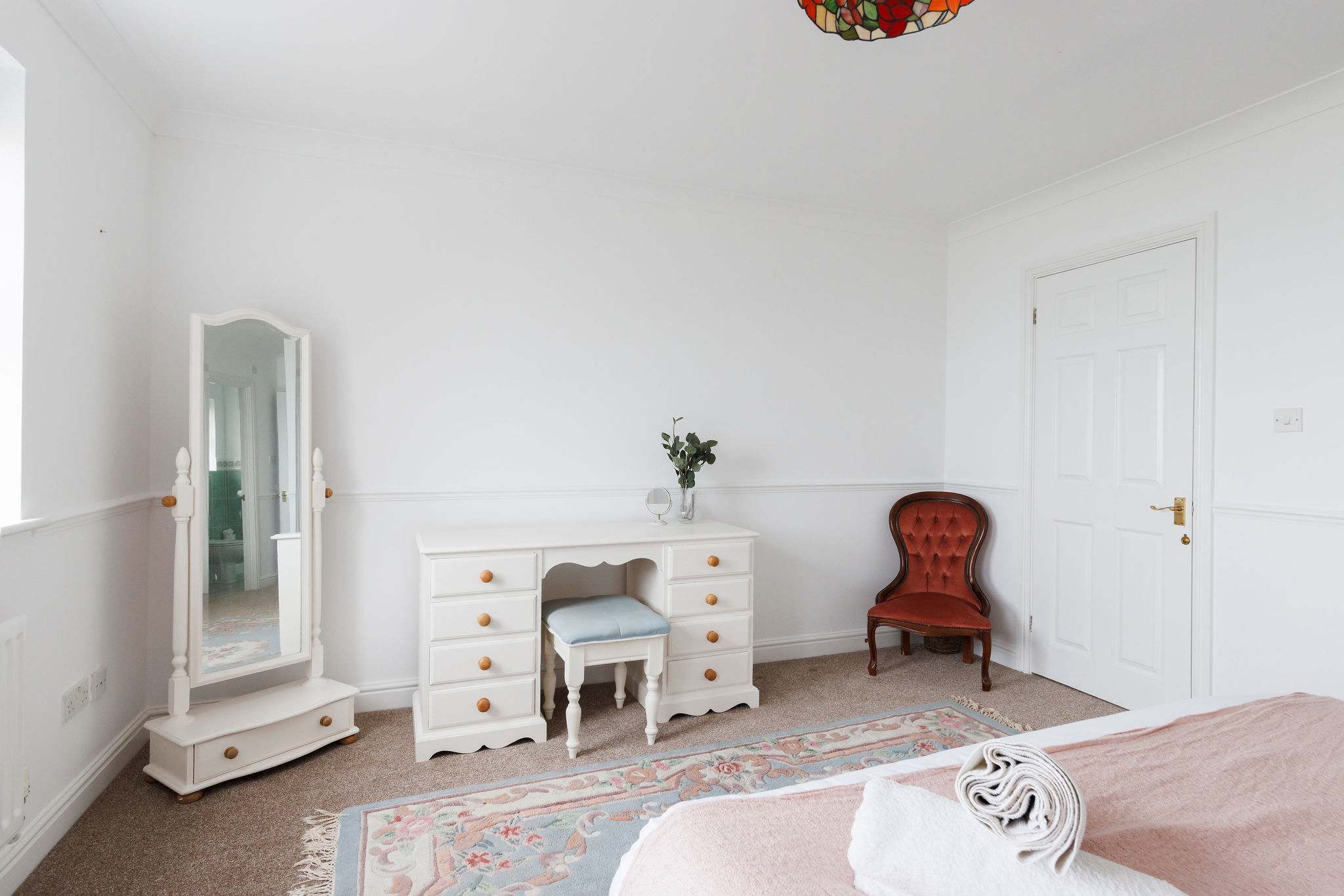 The master bedroom has a vanity table, mirror and draws, with lots of space to get ready in the morning.