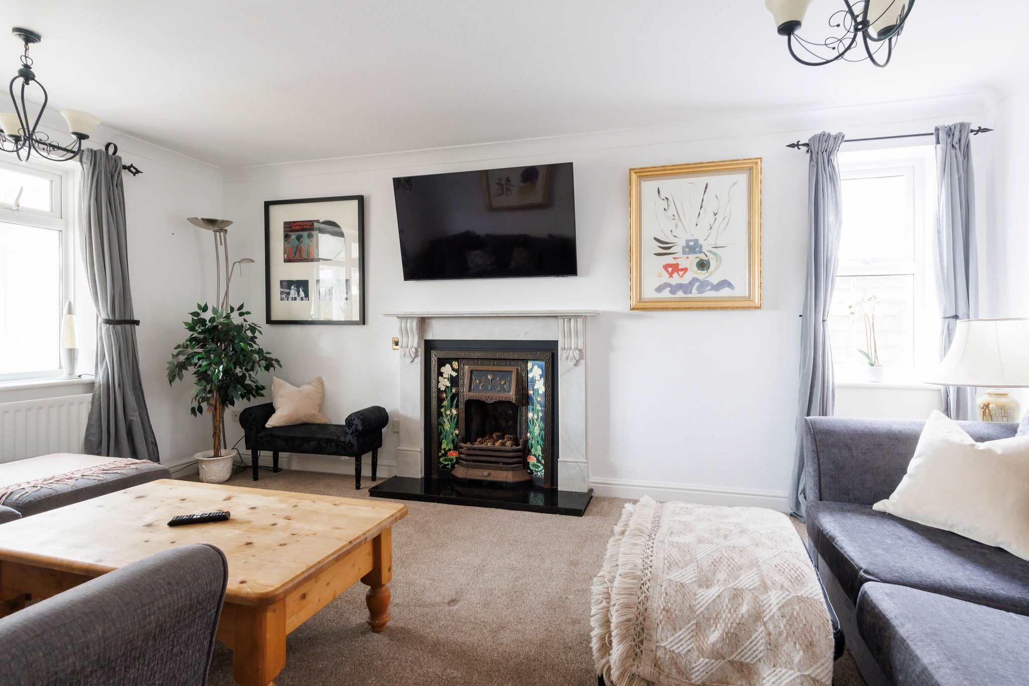 Cosy throws and cushions create a relaxing lounge to retire to after dinner.