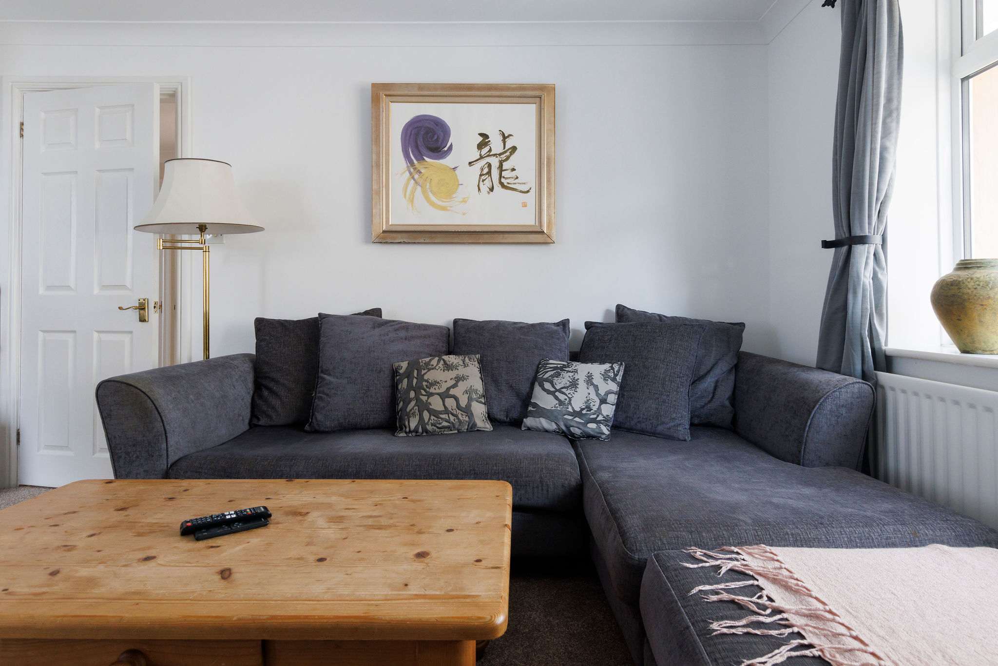 The large L-shaped sofa is the perfect spot to relax and unwind during the evenings.