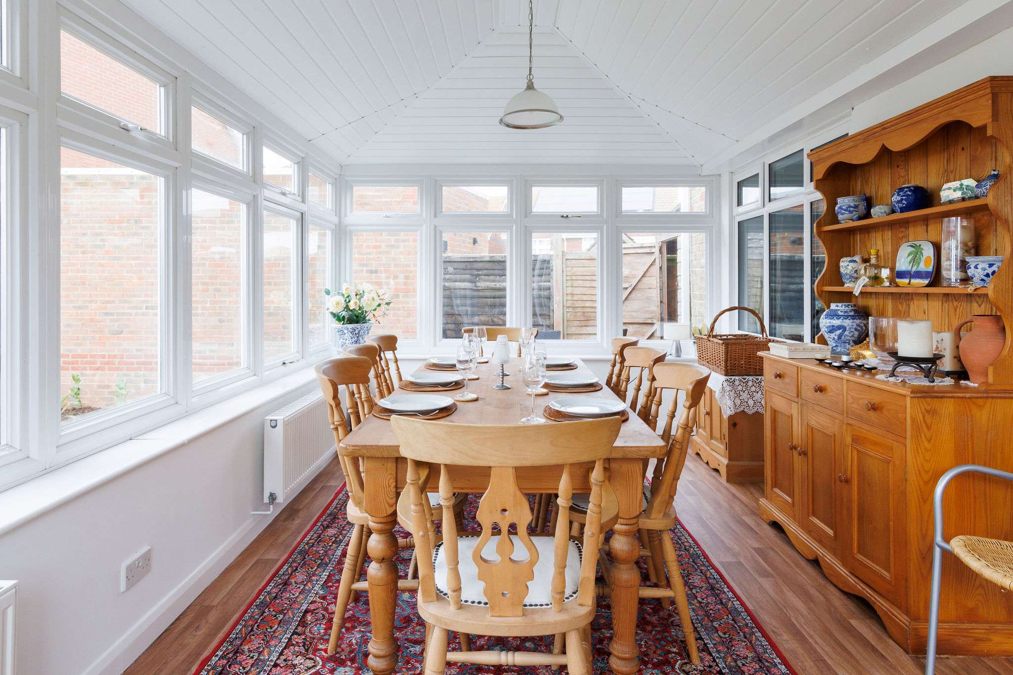 The large dining table comfortably seats 8 guests.