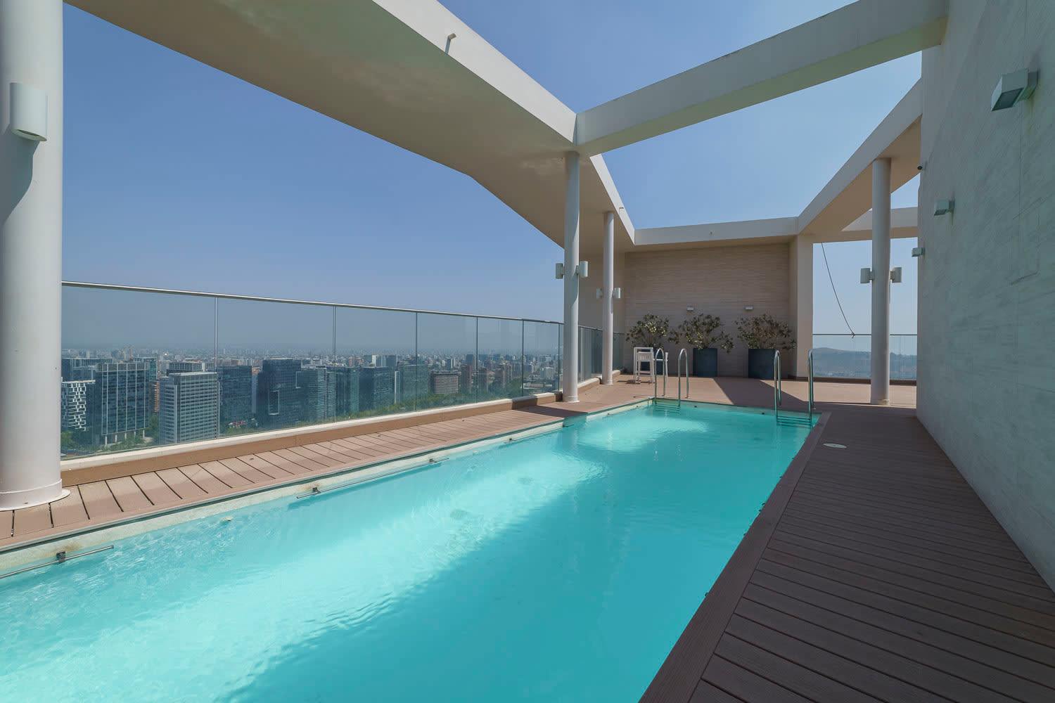 Enjoy breathtaking city views from this stunning rooftop pool, perfect for relaxation and unwinding.